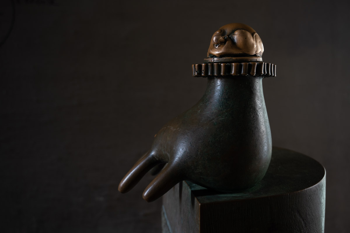 bronze hand, a drinking fountain