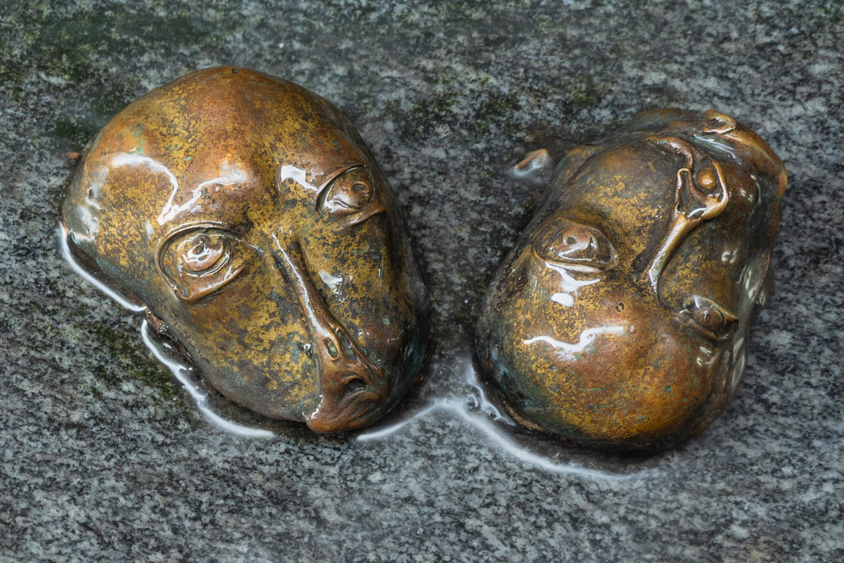 bronze faces on the Locksmith street